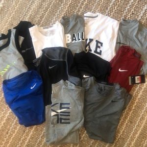 12 new unworn Nike shirts, all size large.